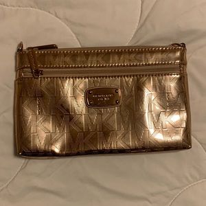 Michael Kors Rose Gold Metallic Wristlet Clutched with four inside card holders